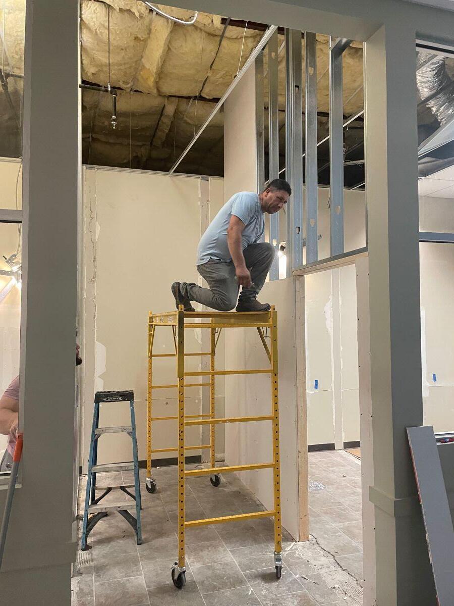 Small Business Incubator SPLOST update man on scaffold