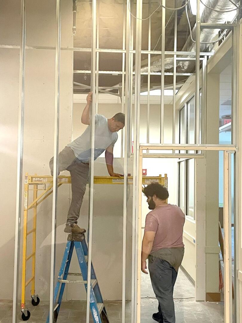 Small Business Incubator SPLOST update two men framing room