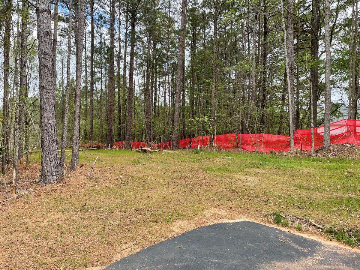 River's Edge Phase 3 construction empty space surrounded by trees