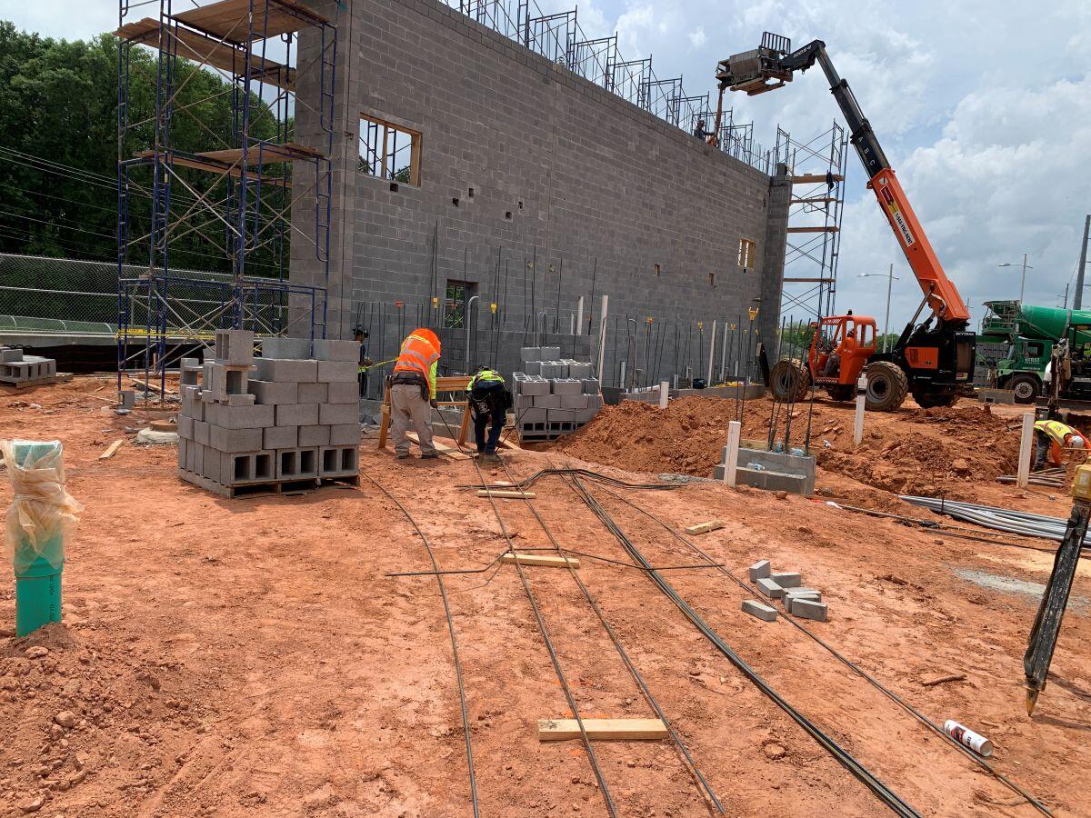 Fire station 9 Construction men laying bricks and forklift
