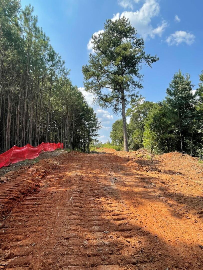 River's Edge Phase III pathway with tractor tracks