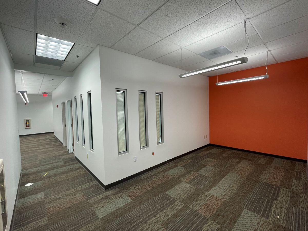 Small business Incubator corner office with orange wall