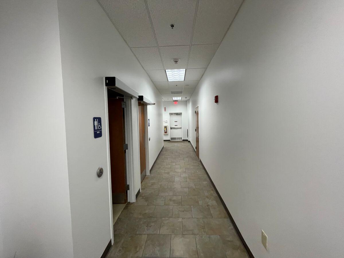 Small business incubator November with hallway, restrooms and exit door