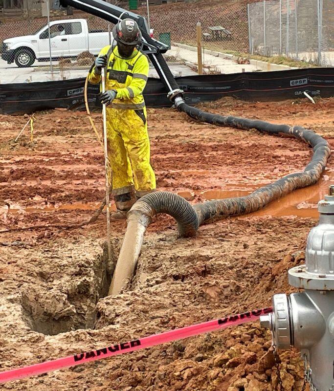 Lakeview updates man standing with hose