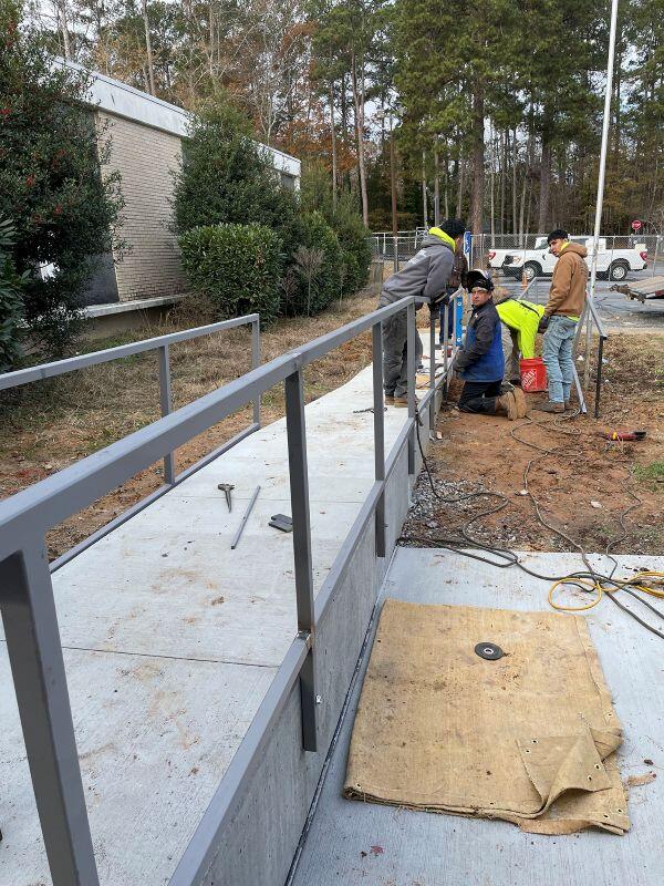 Shelnutt Senior Center men working on railings