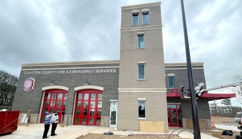 Fire station 9 front view of building with contractors in front