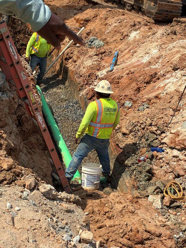 Lakeview Amphitheatre two workers in hole