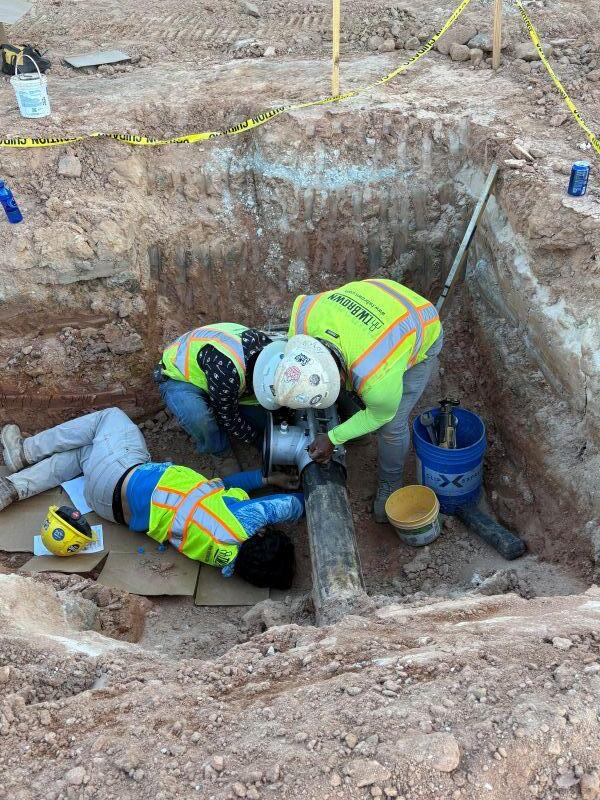 Lakeview Amphitheatre three men in a hole
