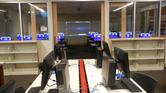 table with computers around it