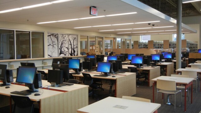 rows of computer stations and seating