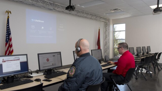 Emergency Management workers at computers in large room