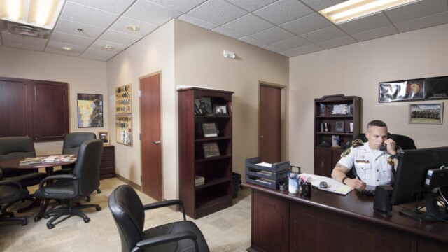 man at desk inside office