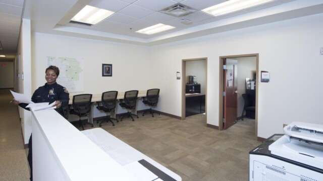inside room with 4 chairs at table along wall
