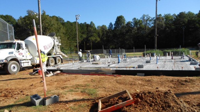 Workers laying foundation