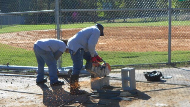 Workers pouring concrete