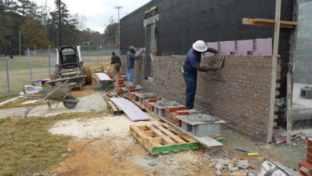 Worker working on exterior walls