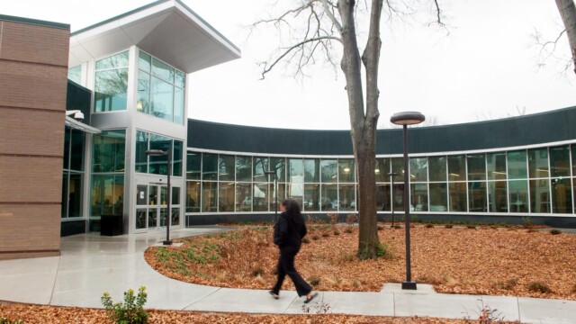 Man walking outside new library
