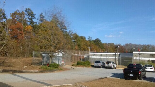 Clayton County Prison - Parking Lot With Scenic Background Clayton County Prison - Parking Lot With Scenic Background