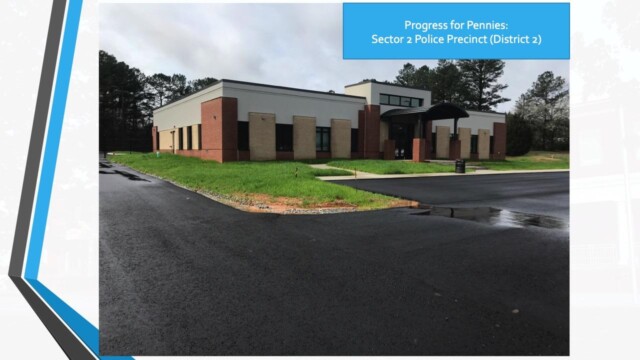 new building with graphic text "Sector 2: Progress for pennies"