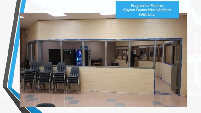 Clayton County Prison - Progress For Pennies - Guard And Inmates In The Background Clayton County Prison - Progress For Pennies - Guard And Inmates In The Background