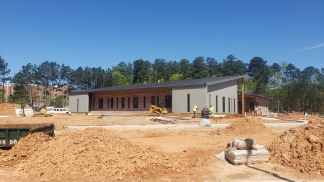 Construction workers working on parking lot of IT Training Center