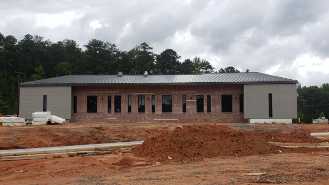 Red clay surrounding the IT Training Center, parking lot not yet there