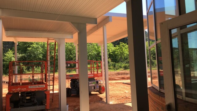 construction equipment under covered front area of building