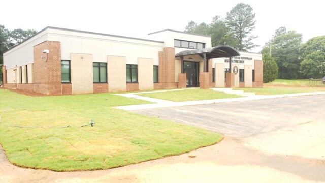 from left side of parking lot, view of building