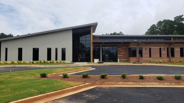IT Training Center front view under construction with downspouts not yet connected