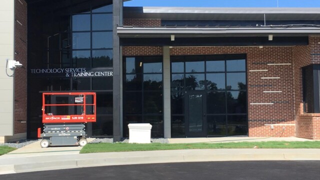 a mobile elevated working platform at the entrance to the IT Training Center