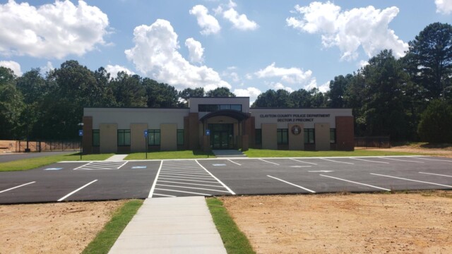 new building and new parking lot with freshly planted grass