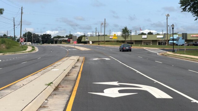 View of Godby Road left turning lane with car passing