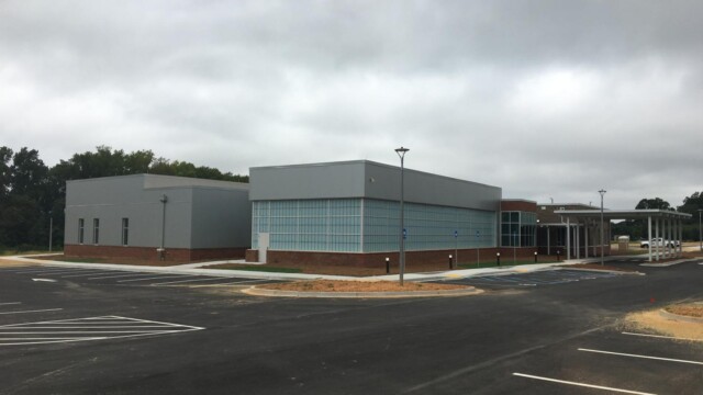 new building and parking lot from left