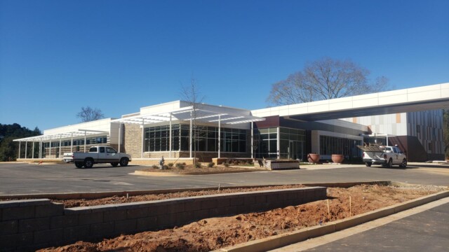 Structural wall and landscaping detail for sloped elevation to the parking lot