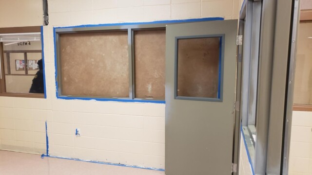 Clayton County Prison - Unfinished Room - Guard Seen The Background Clayton County Prison - Unfinished Room - Guard Seen The Background