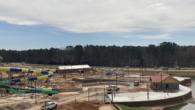 Aerial view of construction of water park, partially slabbed with concrete