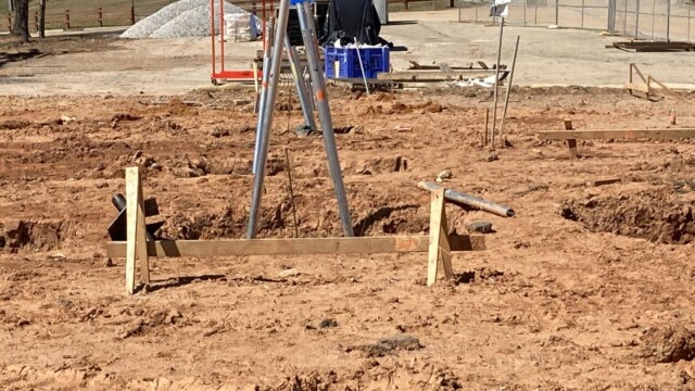 Metal and wood structures in dirt