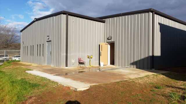 Clayton County Prison - Muddied Pavement Outside Opened Door Clayton County Prison - Muddied Pavement Outside Opened Door
