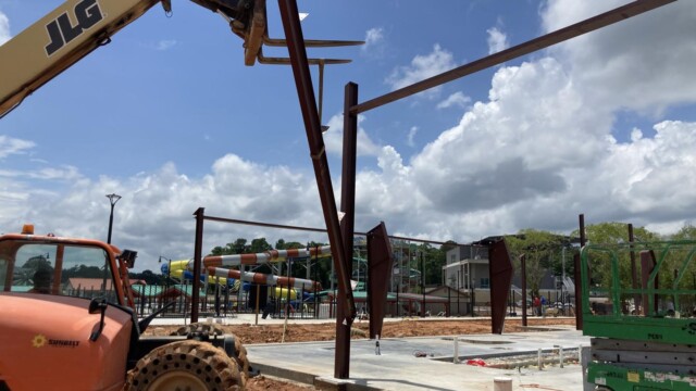 Telehandler placing metal beam