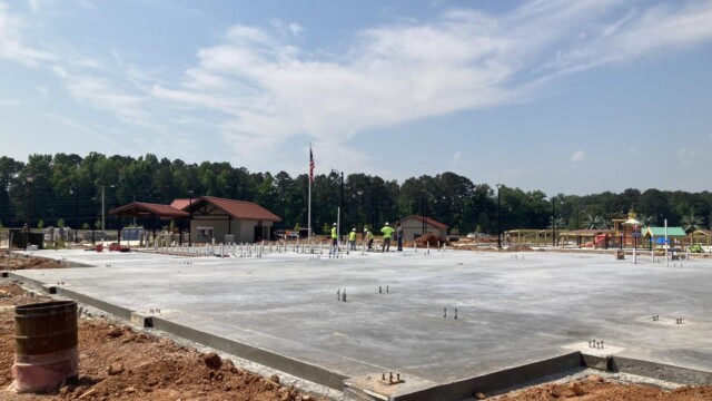 Construction workers on a big concrete slab