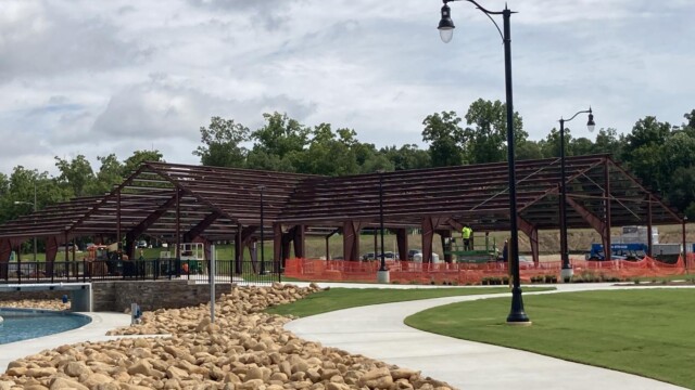 Metal framing for building with rocks and light poles