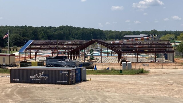Metal framing for building next to 3 trailers