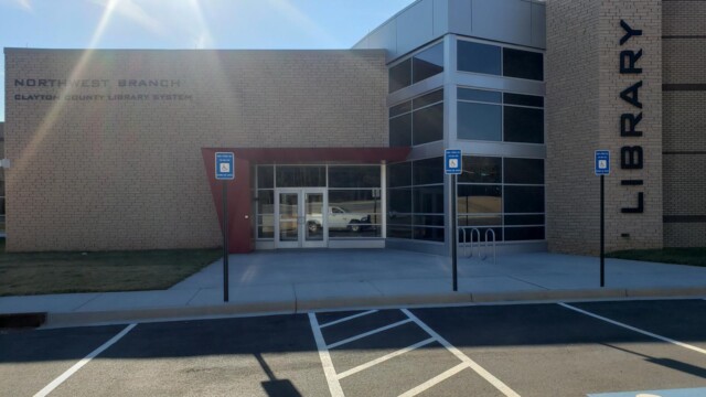NW Library as seen from a vehicle driving through the parking lot