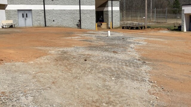 Clayton County Prison - Back of Building - Uneven Stoney Dirt Path Clayton County Prison - Back of Building - Uneven Stoney Dirt Path