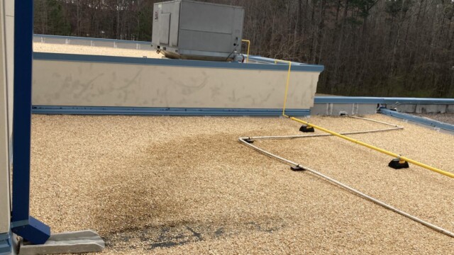 Jim Huie Roof at two different levels with water spout