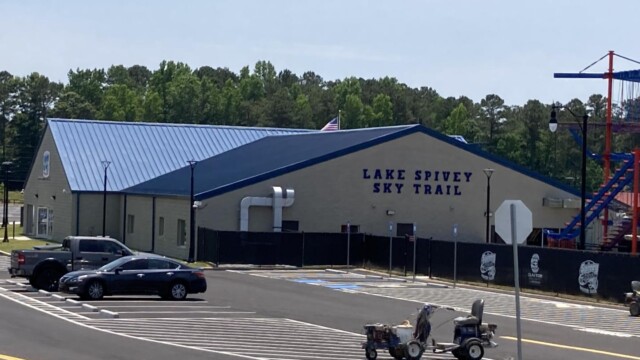 Nassau building with cars in the parking lot