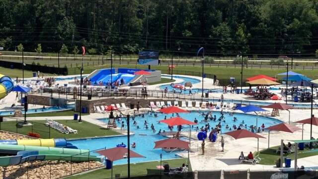 International Water Park with people enjoying water zoomed in