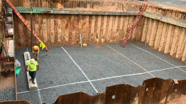 View of worker in hole