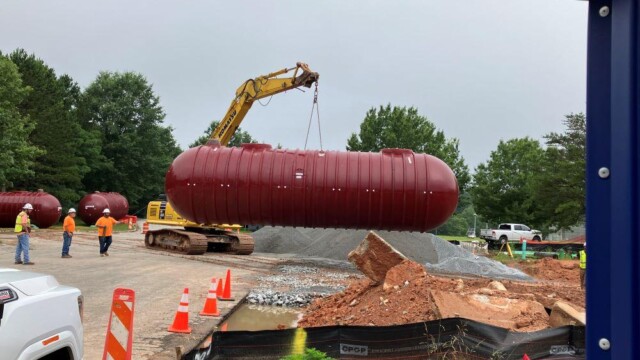 Crane picking up pump