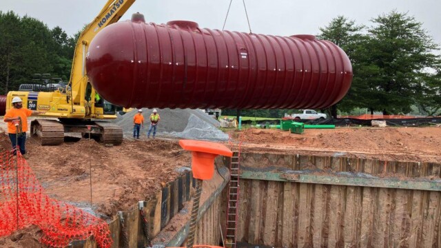Crane moving pump to hole